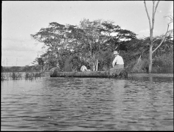Image 2: “Surveyor in dugout canoe”.